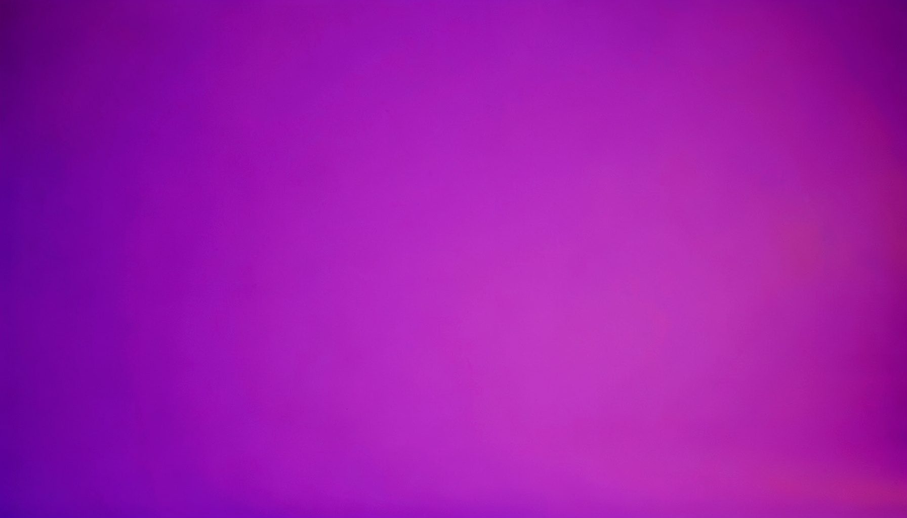 Soft gradient studio photograph on a seamless backdrop, blending deep violet and warm pink light, conveying a calm technical mood.